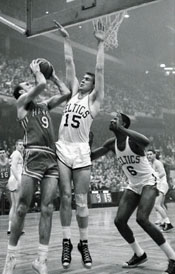 Bob Pettit tries to shoot over Tom Heinsohn.